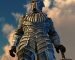 Looking up at armored knight against a dramatic sky - 3D render.